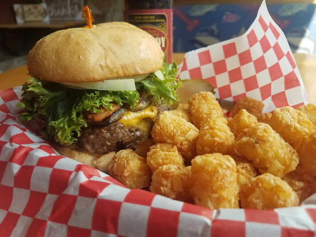 A delicious looking burger and tater tots at Austin House.