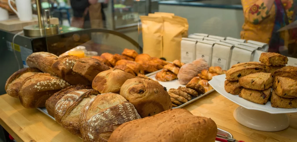 Delicious fresh breads and pastries in a display case at Bodhi Bakery.