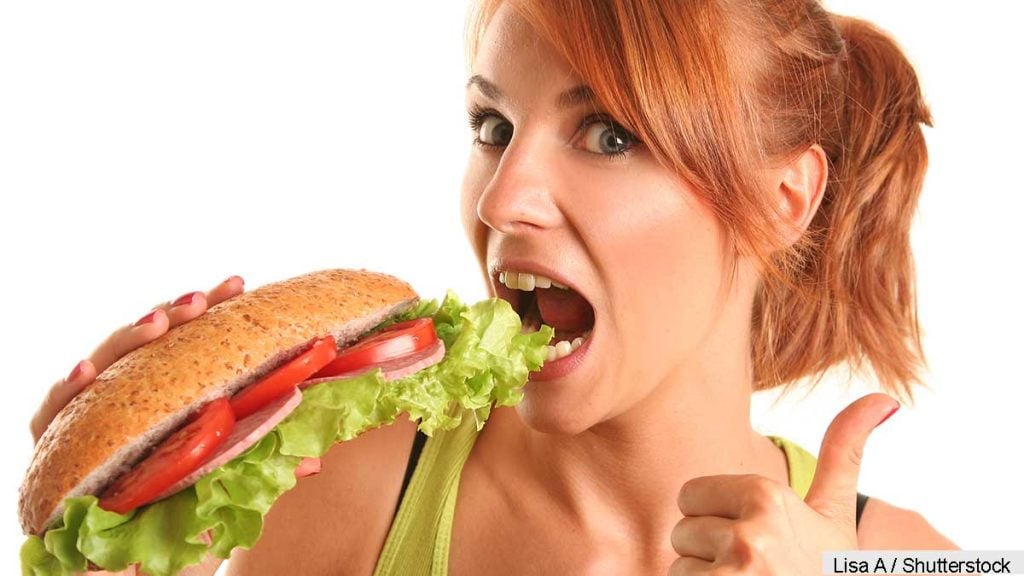woman eating subway