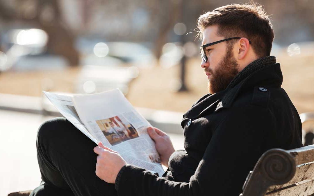 Weirdo Boldly Reads Newspaper in Public Instead of Mindlessly Doomscrolling Like the Rest of Us