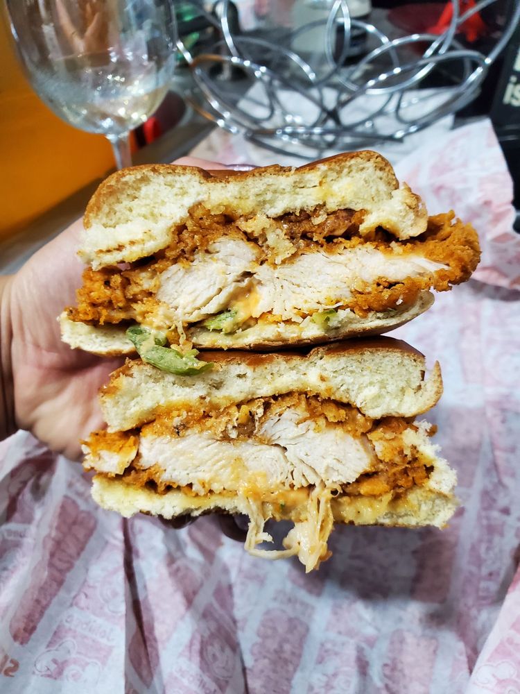 A delicious looking spicy chicken sandwich, cut in half.