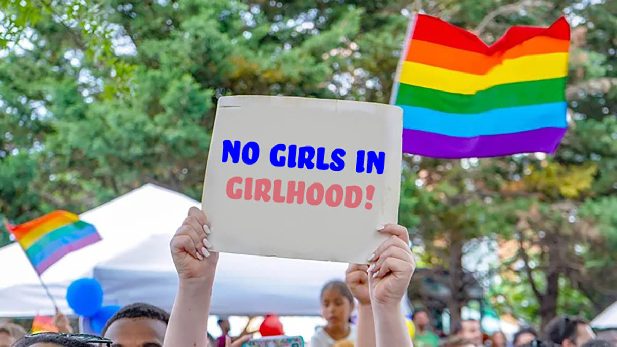 no girls in girlhood sign protest