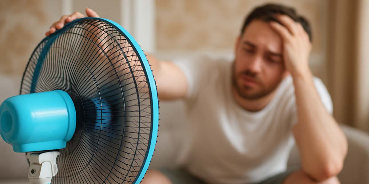 man trying to cool off in the heat