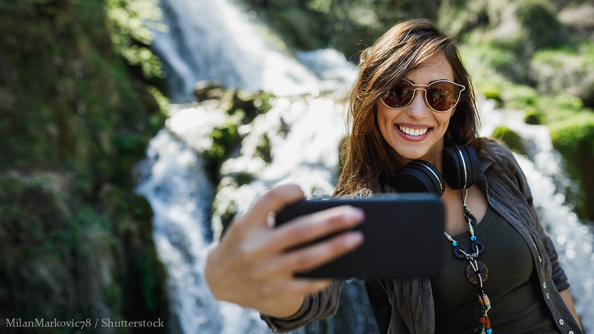 woman hiking waterfall
