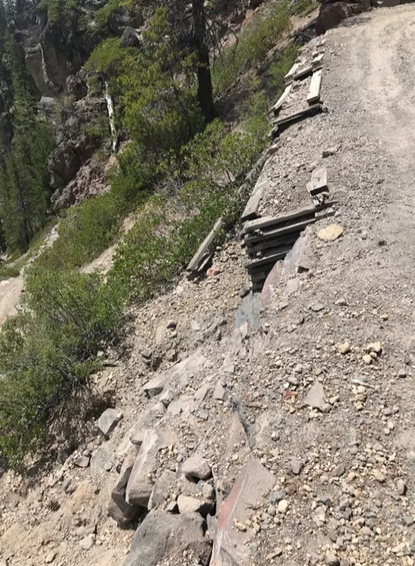 A retaining wall along Cleetwood Cove Trail shows serious leaning from material movement