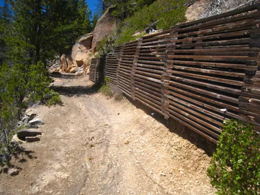 A retaining wall that's undercut, and trail damage at Cleetwood Cove.