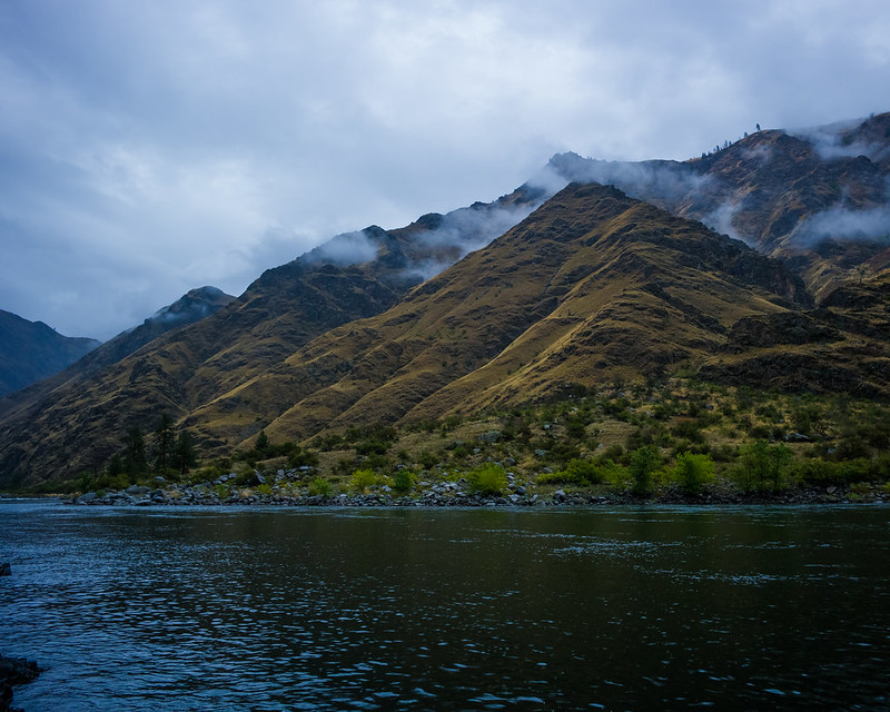 A view of the towering cliffs around the river inside Hell's Canyon.