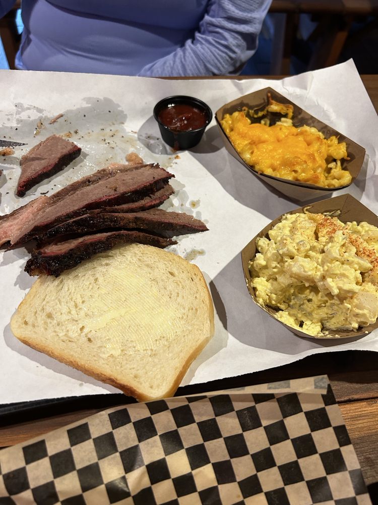Brisket with a side of mac n cheese and potato salad.