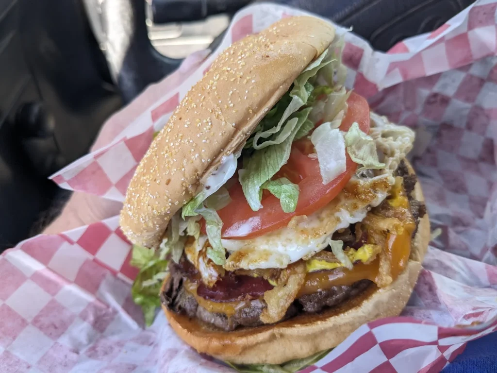 The sunrise burger stacked high with toppings.