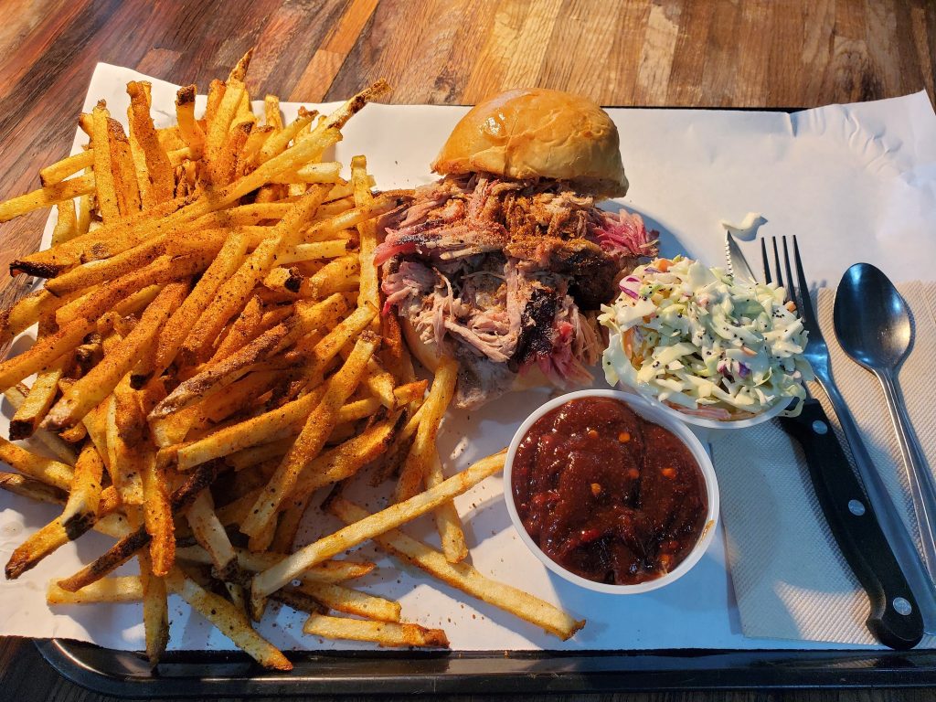 Pulled pork sandwich with fries and slaw at Rattlesnake BBQ in Dexter, Oregon.