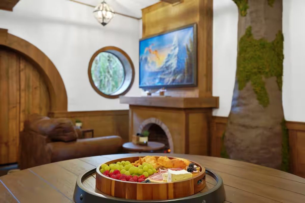 Snacks sit on the round table in the living room.