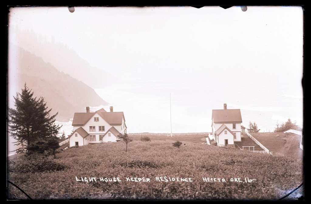 An old sepia photo of the two light keeper's cottages.