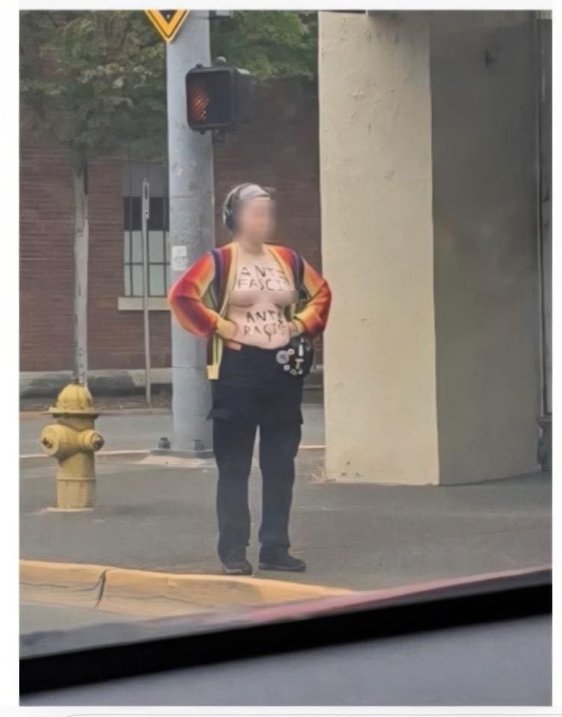 Springfield teacher protesting topless downtown Springfield, Oregon