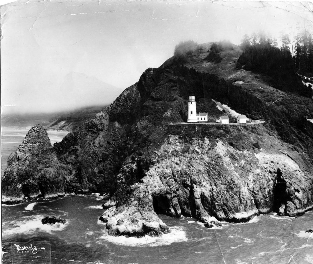 A black and white photo of Heceta Head.