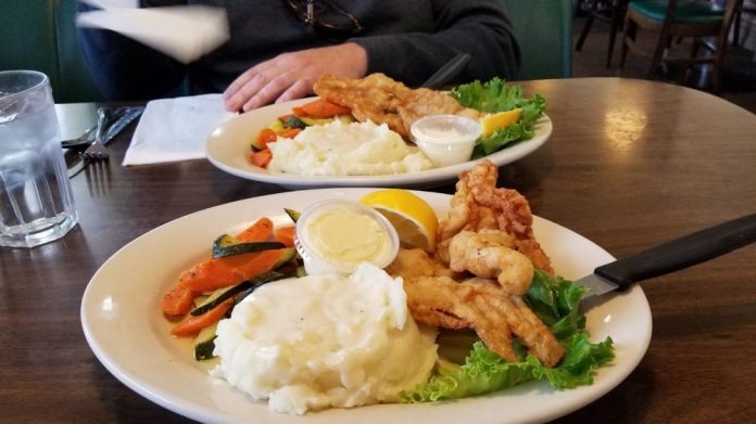 Fried fish and shrimp dinner with mashed potatoes and vegetables served at The Berry Patch Restaurant on the Oregon Coast