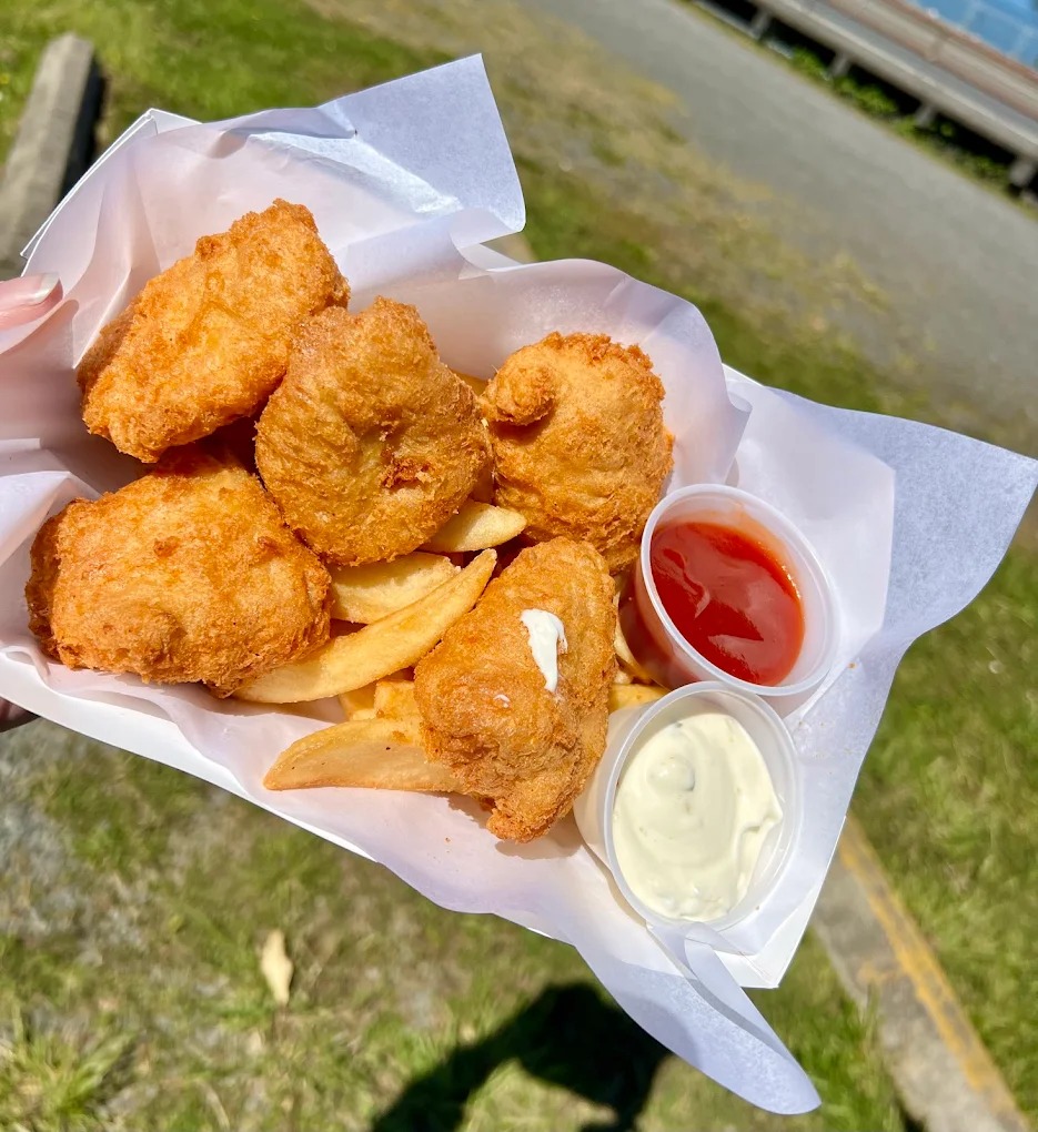 Bowpicker albacore fish and chips basket with steak fries and dipping sauces in Astoria Oregon