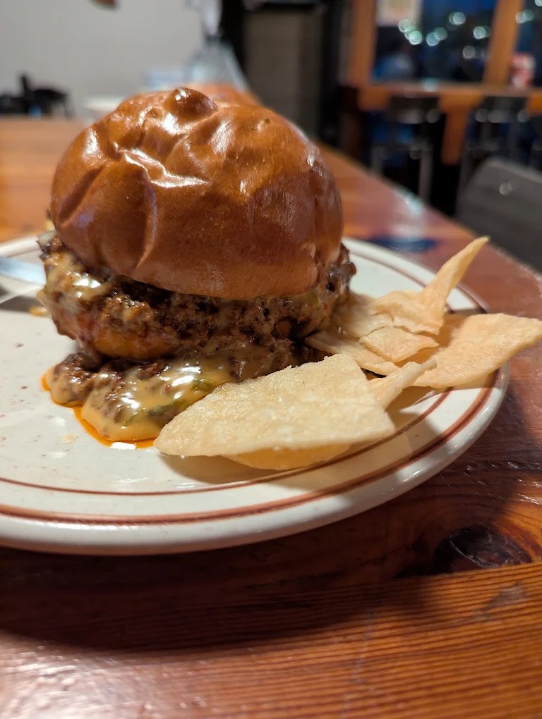 Texas-style brisket and smoked meats at Podnah’s BBQ in Portland Oregon, wood-fired barbecue restaurant interior and classic Southern sides