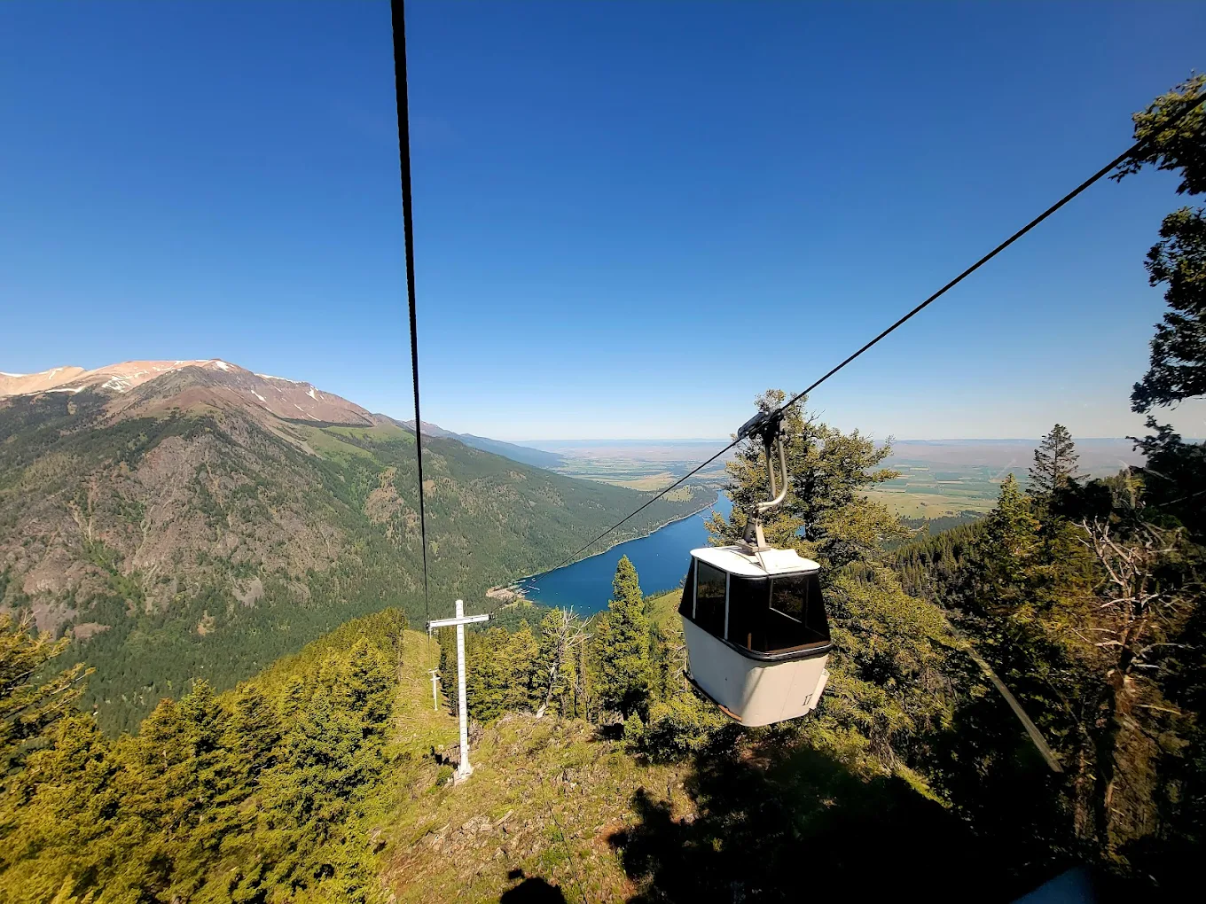 Photo by Tim Ahaus via Google Local 1. A gondola on the Wallowa Lake Tramway goes down the mountain. Wallowa lake sits in the distance.
