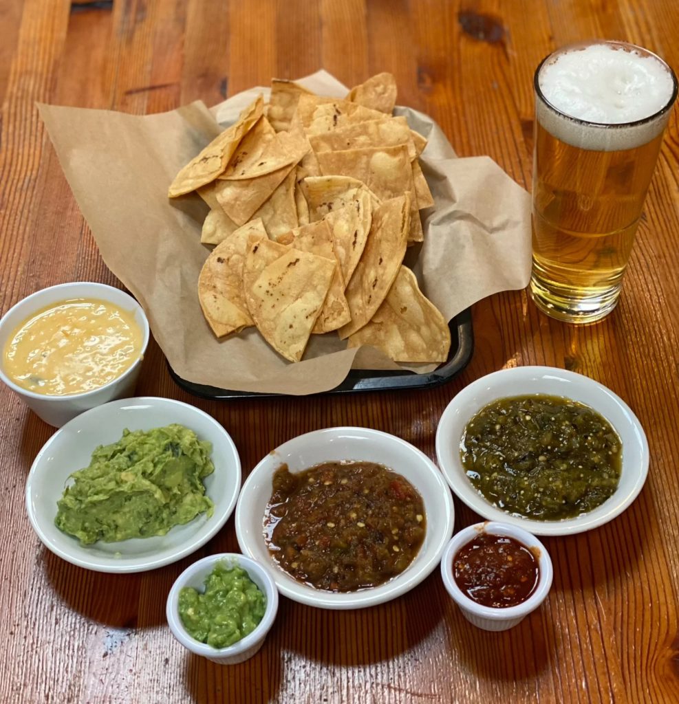 Texas-style brisket and smoked meats at Podnah’s BBQ in Portland Oregon, wood-fired barbecue restaurant interior and classic Southern sides