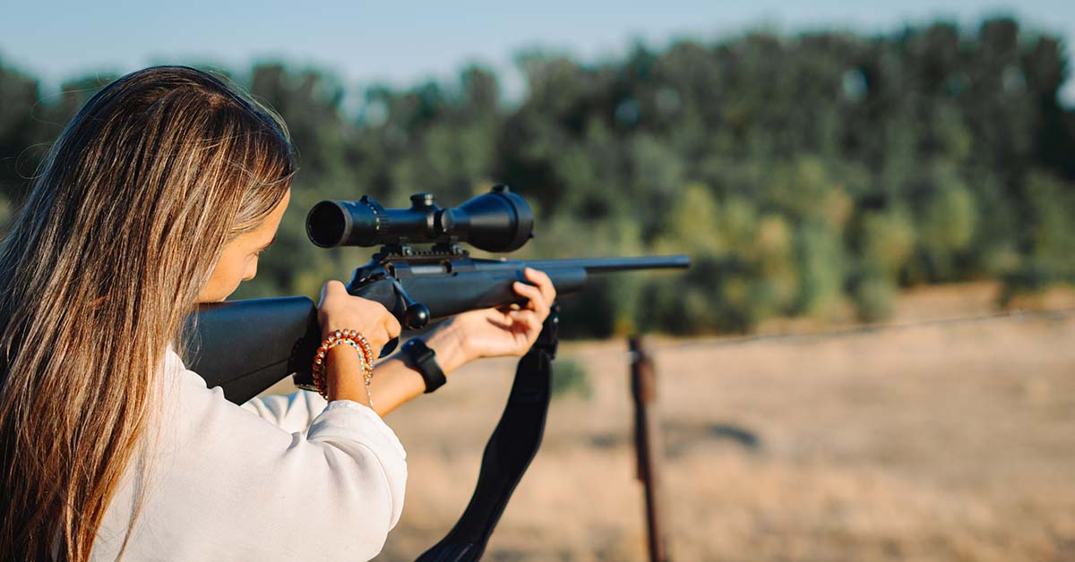 woman_with_rifle Woman with rifle at shooting range