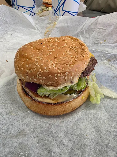 handcrafted burger with fresh toppings and soft bun
