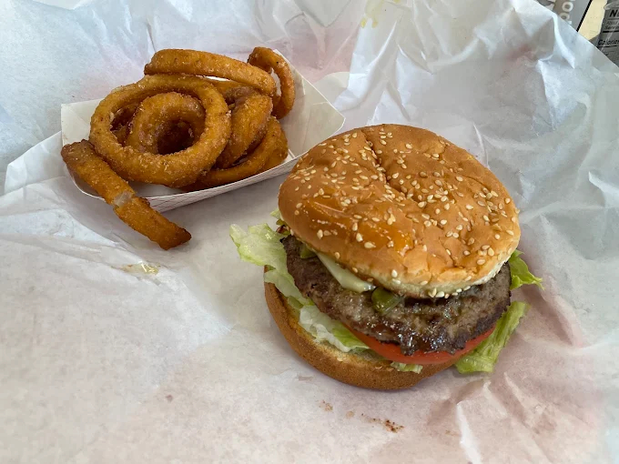 onion rings and burger combo at casual roadside restaurant