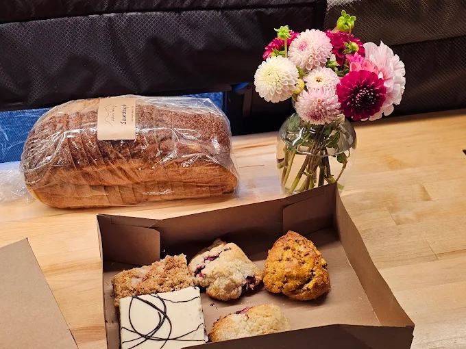 Rustic bakery display featuring fresh bread loaves, pastries, and sweets in Sisters Oregon