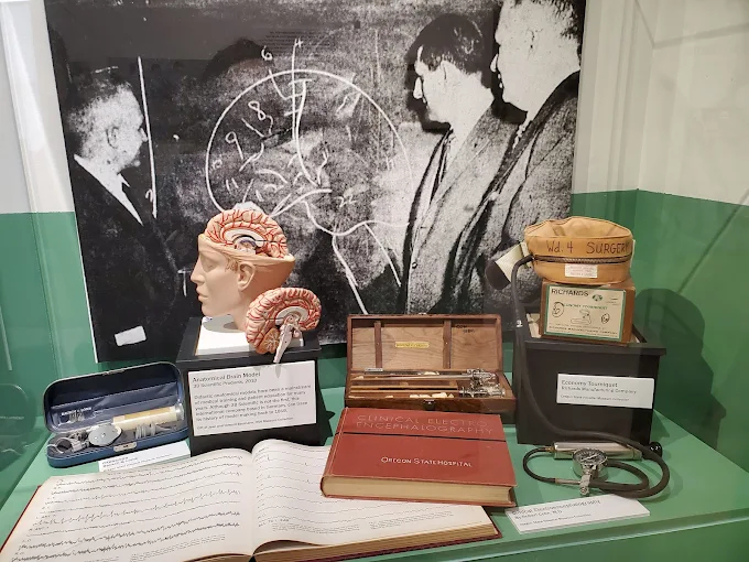 Mental health history exhibit inside OSH Museum of Mental Health Salem Oregon showing patient records artifacts and historical displays