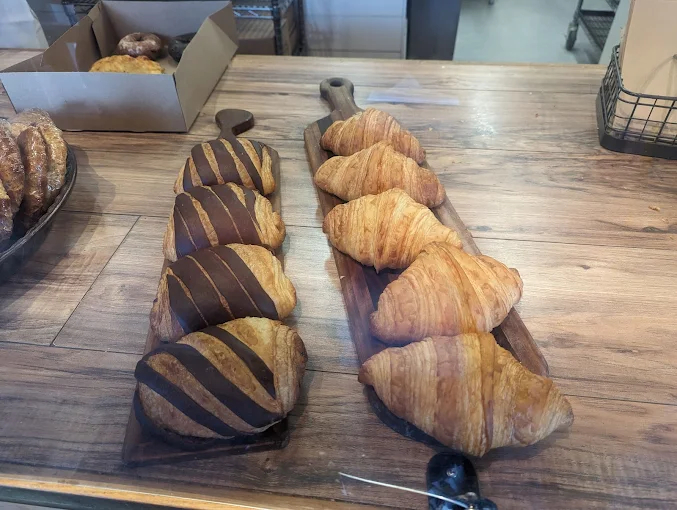 Fresh baked pastries and donuts at Sisters Bakery in Oregon with warm rustic display and artisan treats
