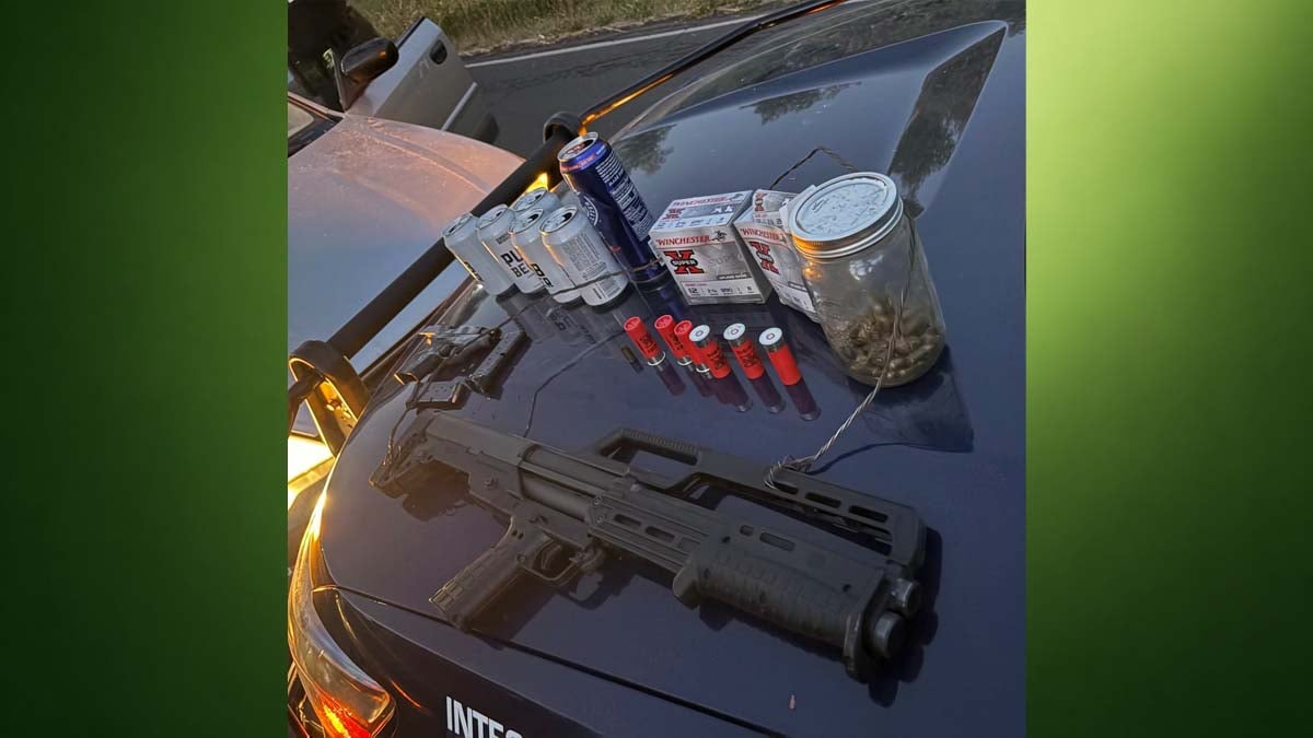 green-news-background Handgun, shotgun, ammunition and beer cans displayed on the hood of an Eugene Police vehicle after an arrest.
