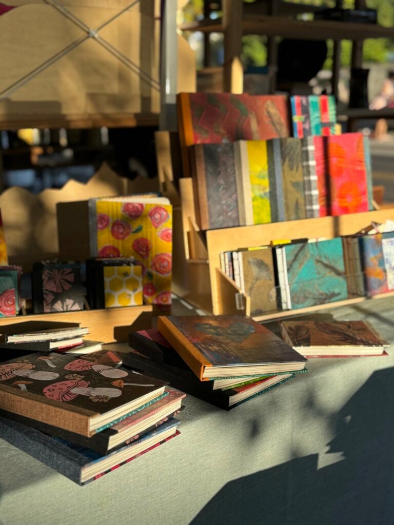 Handmade books and art displayed at Eugene Saturday Market