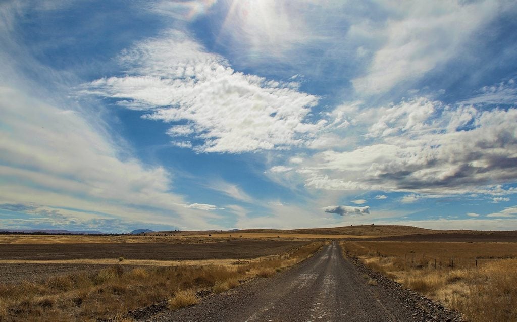 The Two-Finger Wave, Rural Oregon, Courtesy, Steering Wheel Wave, Back Roads, Look Like a Local, Unspoken Rule, Driving Tips