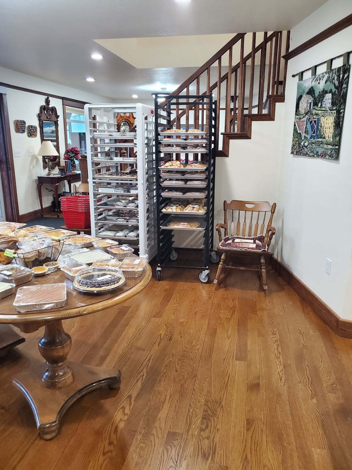 The bakery’s staircase, wooden furniture, and baked-goods displays.