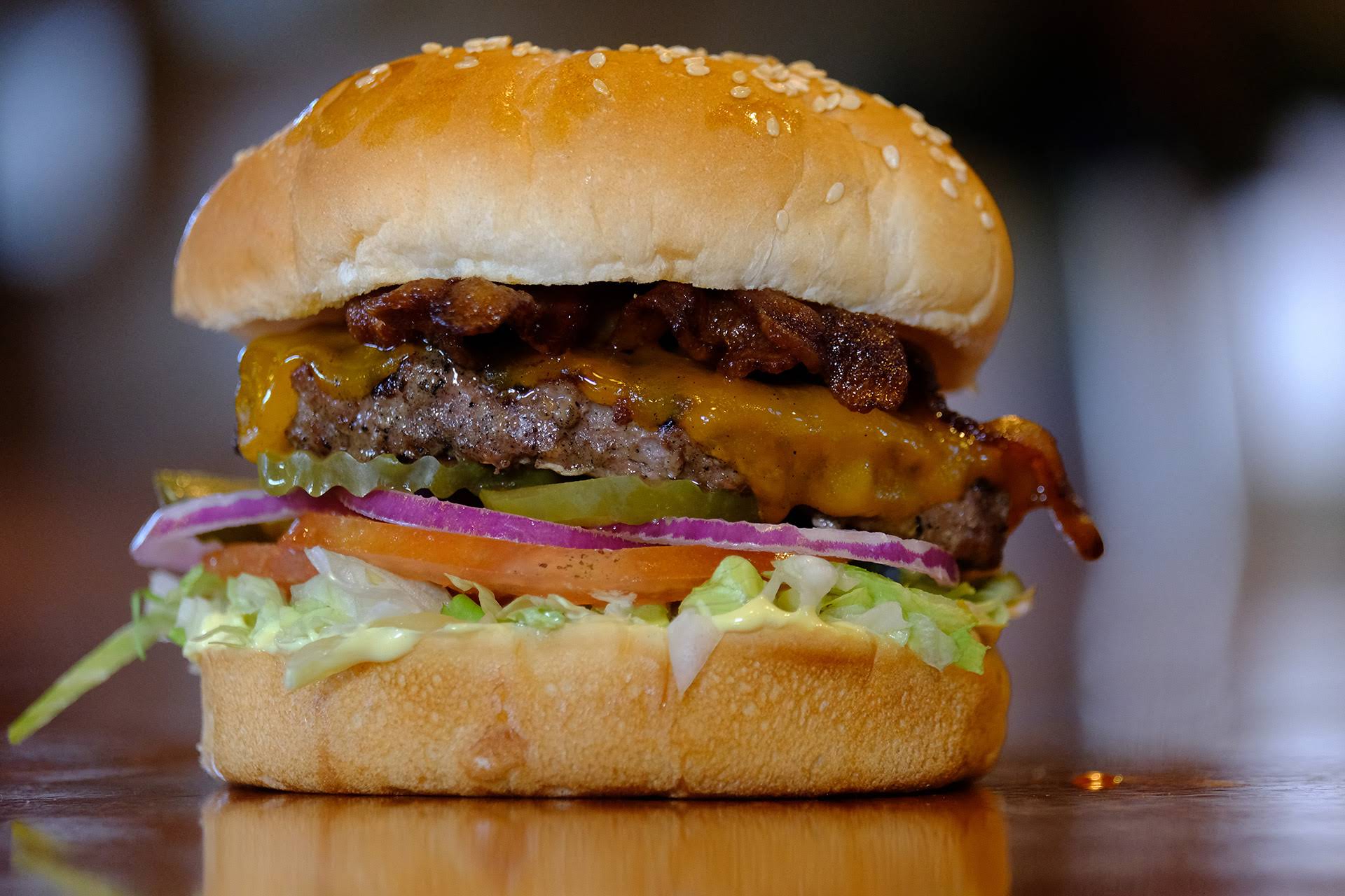Bacon cheeseburger with lettuce, tomato, red onion and pickles at Dillon’s Grill