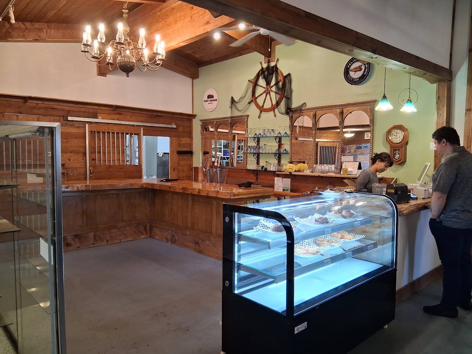 The ordering counter, bagel case, and nautical decorations at Grumblefish.