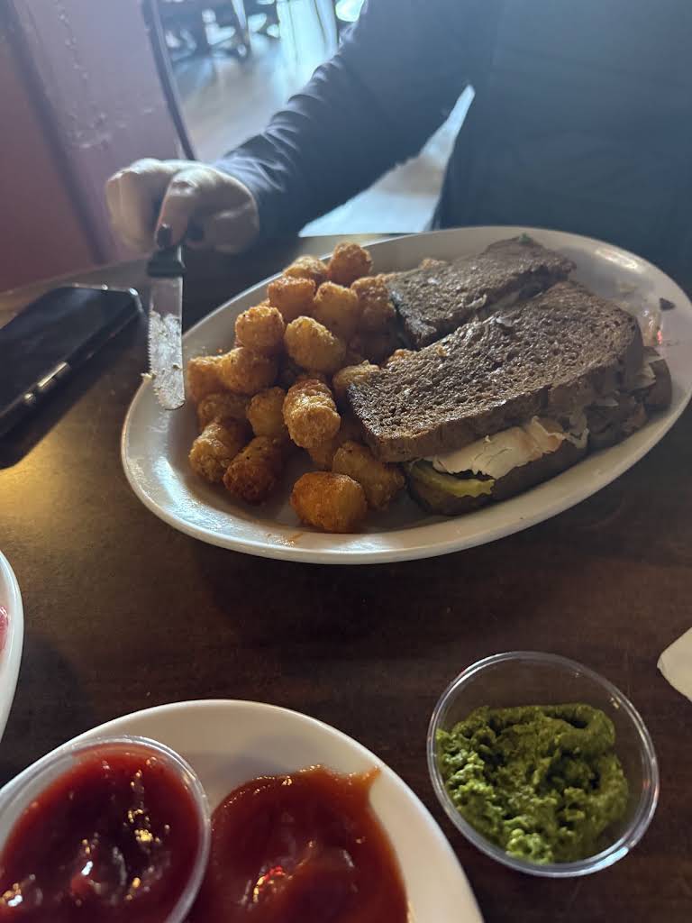 Turkey Reuben on dark bread with tater tots at Mac’s Place in Silverton
