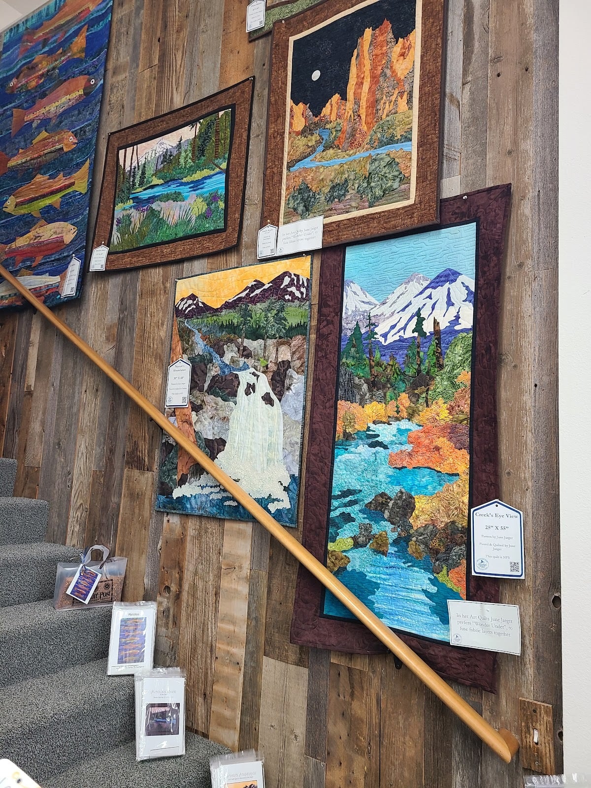 Landscape textile art displayed inside Stitchin’ Post in September 2022.