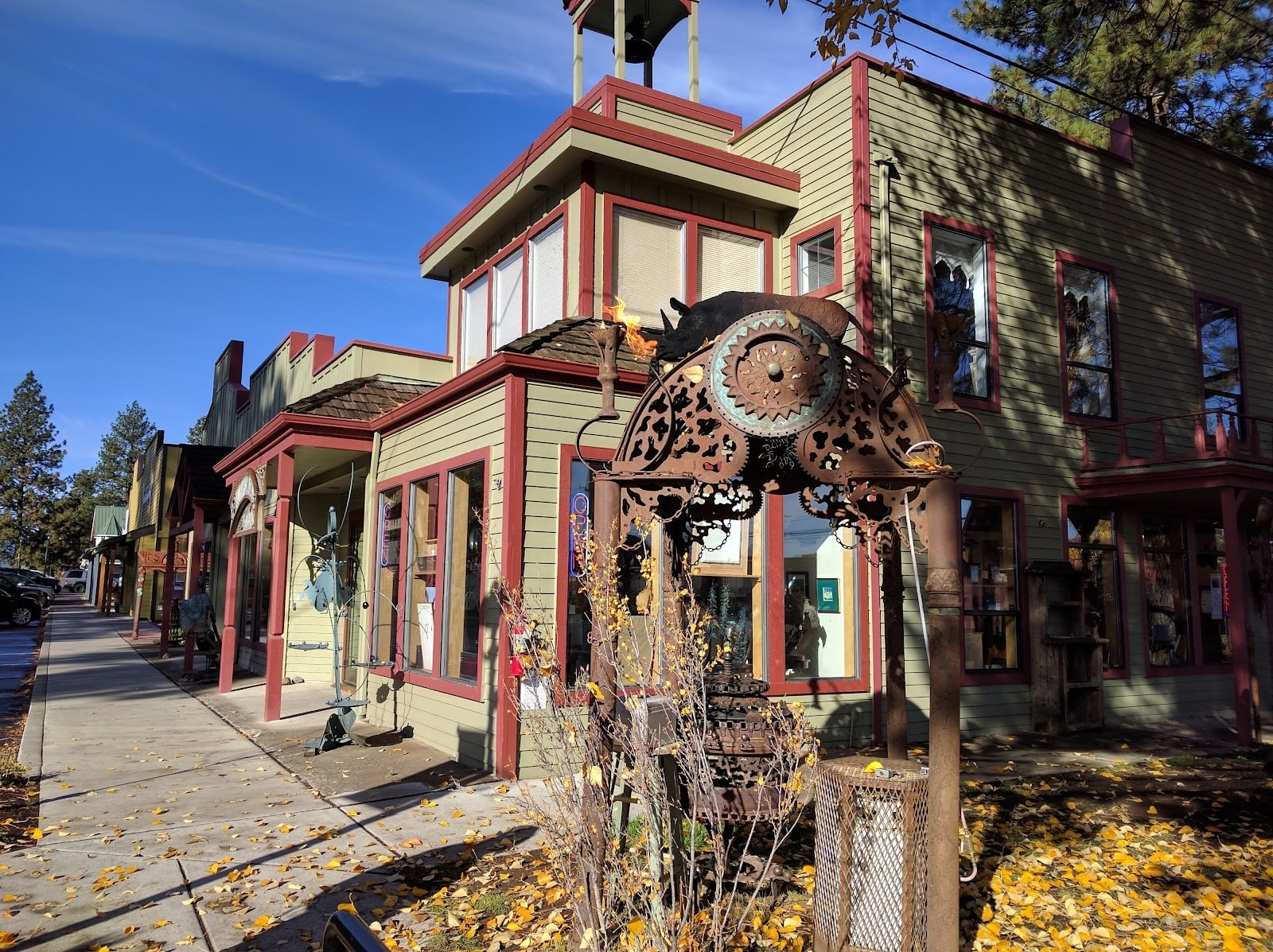 A colorful Sisters storefront and sidewalk sculpture in a visitor photo