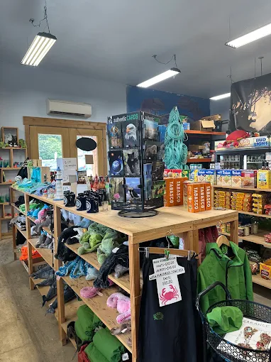 Marina store shelves stocked with sauces, souvenirs, and crabbing supplies