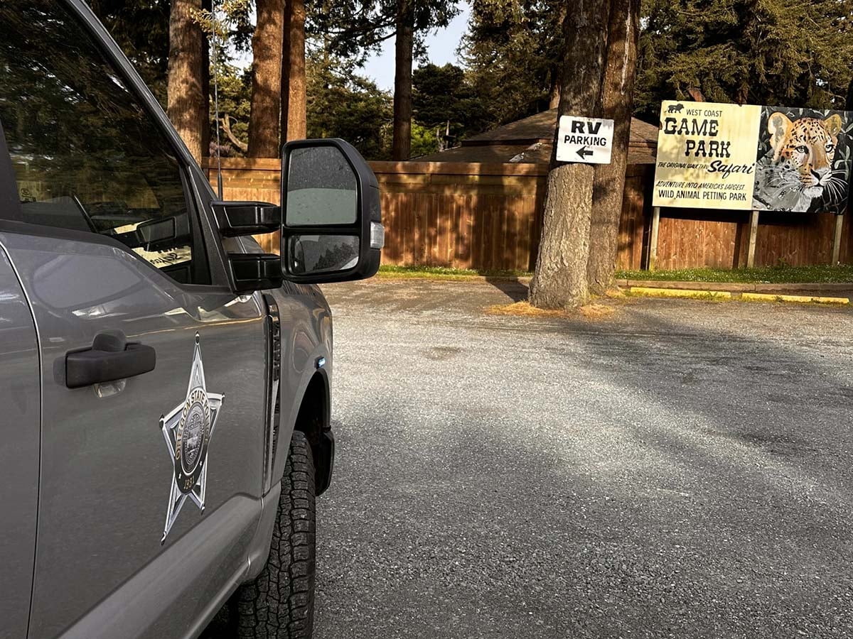west-coast-safari Oregon State Police vehicle outside West Coast Game Park Safari near Bandon while officers served search warrants on May 14, 2025.