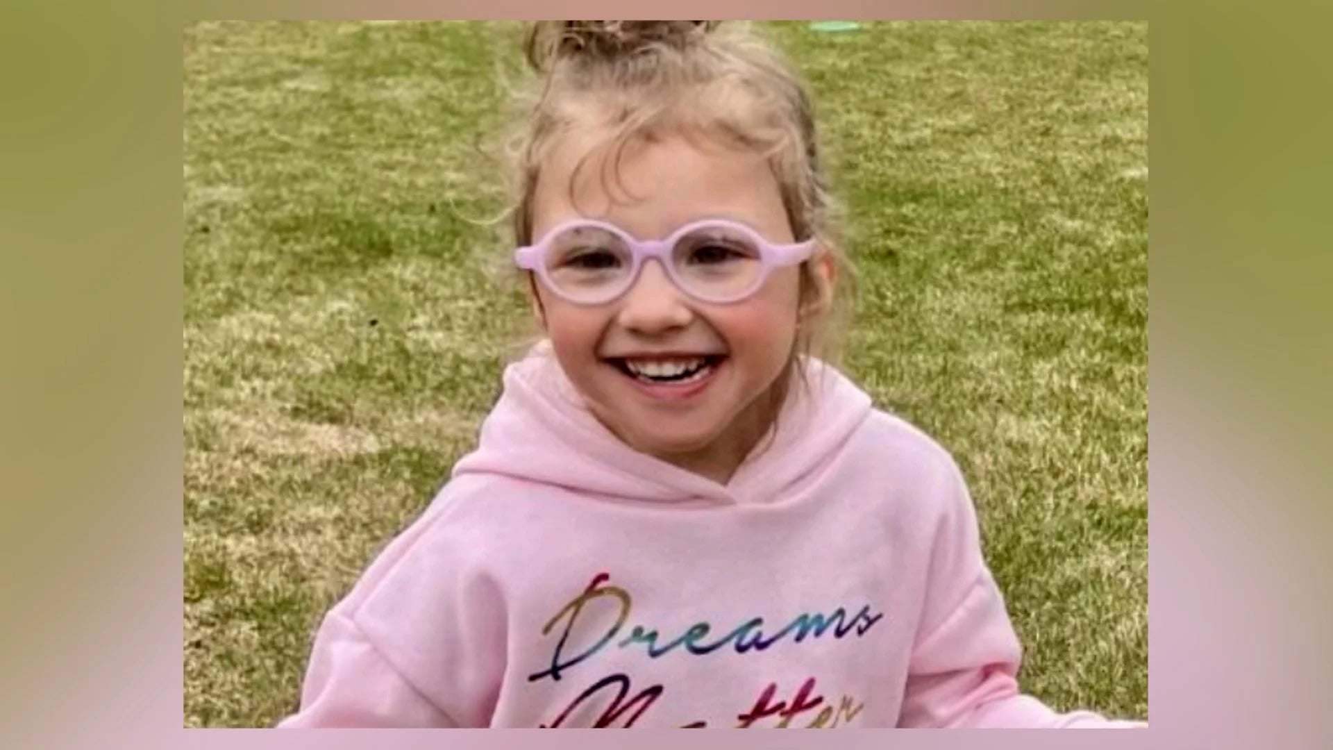 Saylor Graham-Poarch smiling in pink glasses Saylor Graham-Poarch smiling outdoors in pink glasses and a pink hoodie in a previously shared photograph.