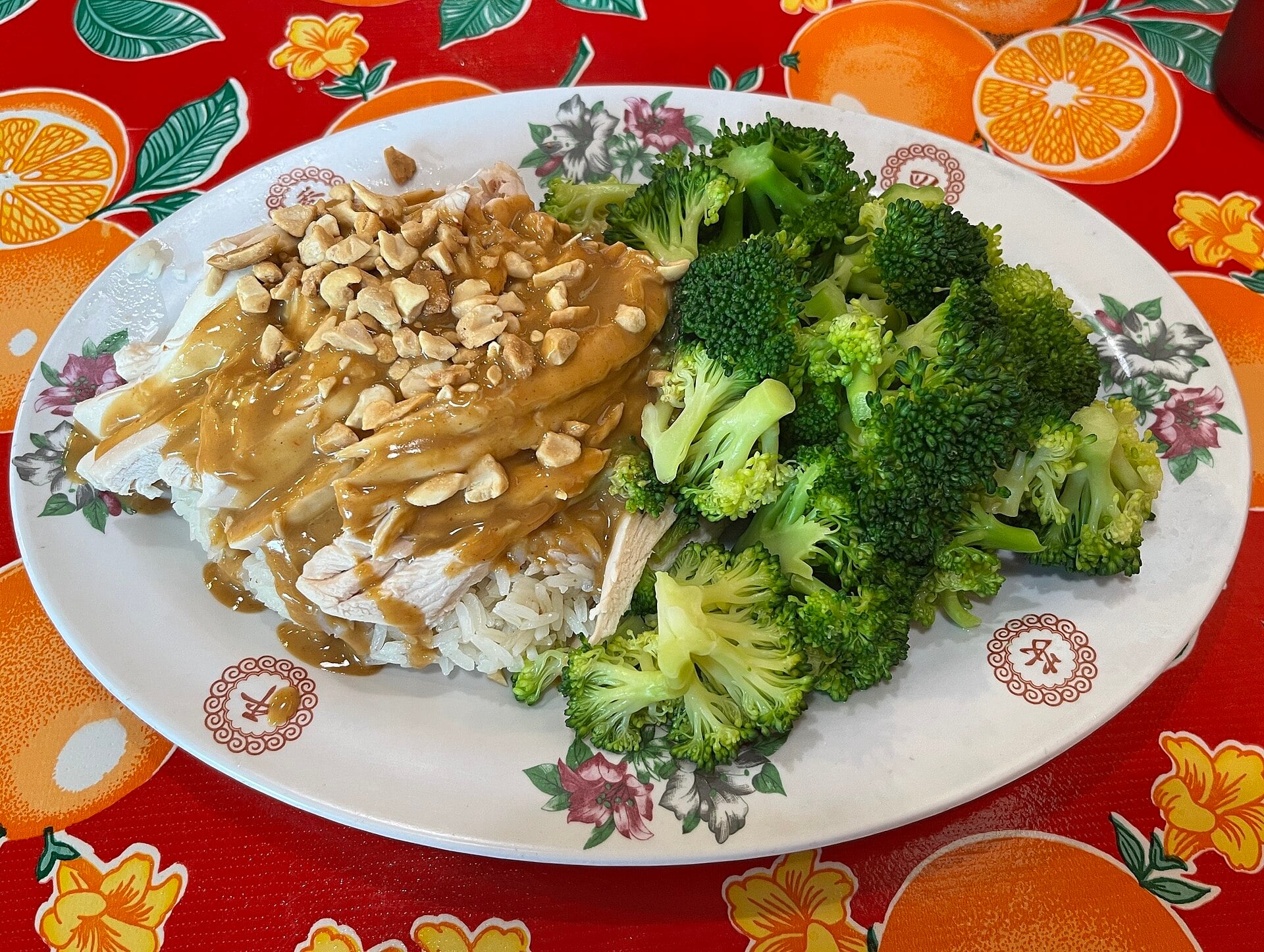 Chicken and broccoli on rice with peanut sauce at Nong’s Khao Man Gai