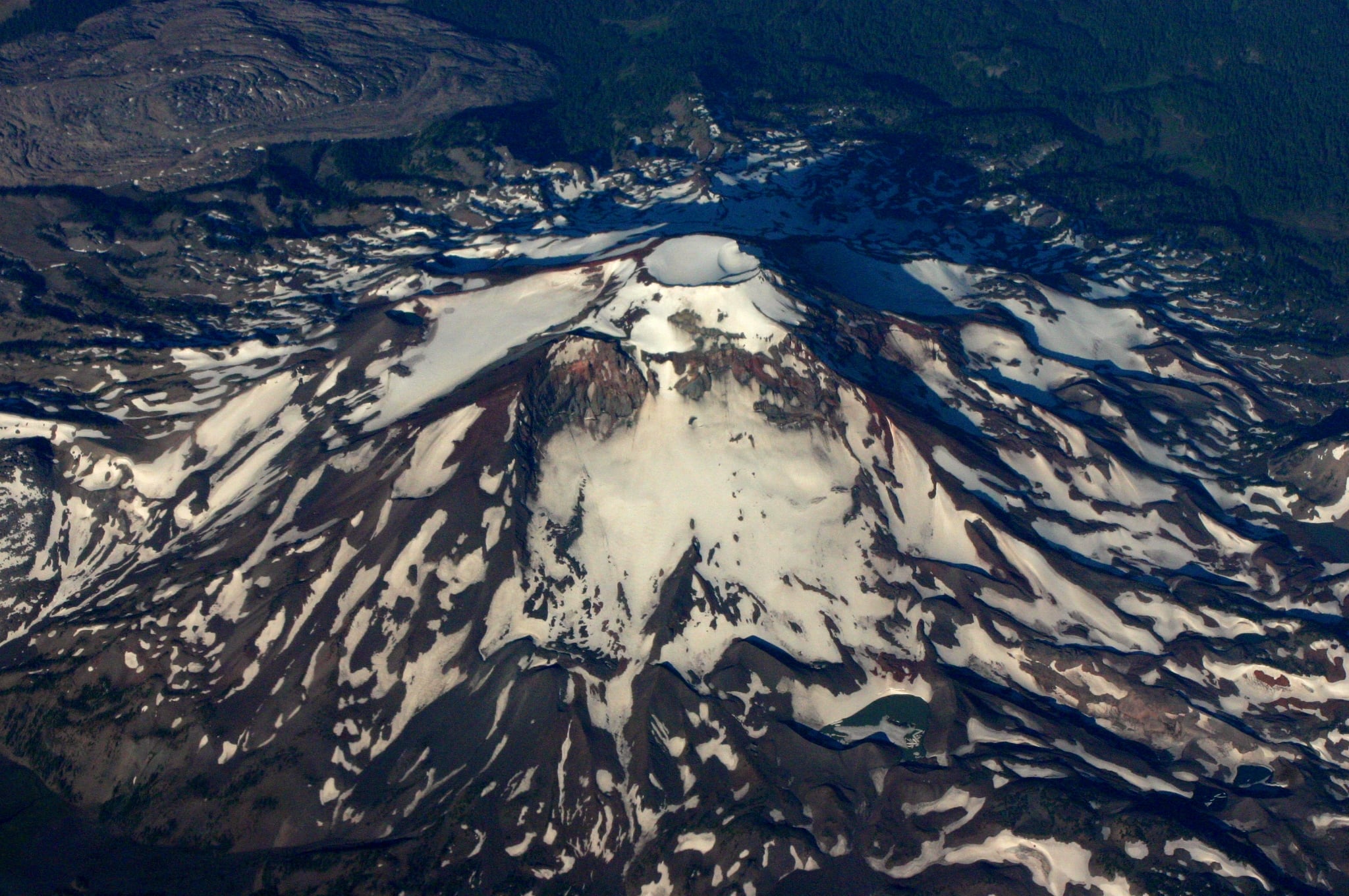 Aerial view of South Sister summit caldera Aerial view from the northeast of the snow-covered summit crater and slopes of South Sister in Oregon