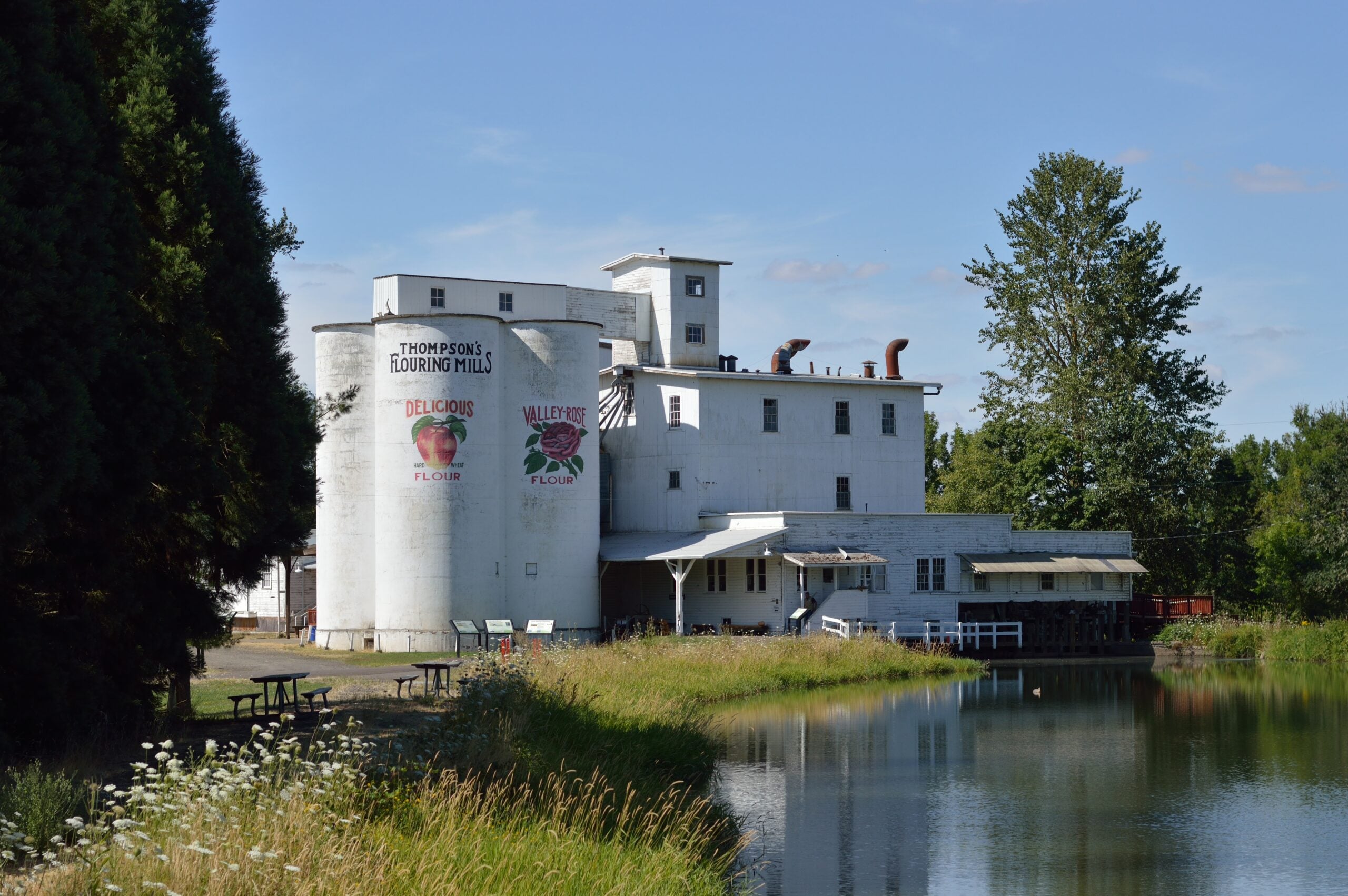 Thompson’s Mills mill exterior across water mill exterior across water at Thompson's Mills State Heritage Site near Shedd, Oregon